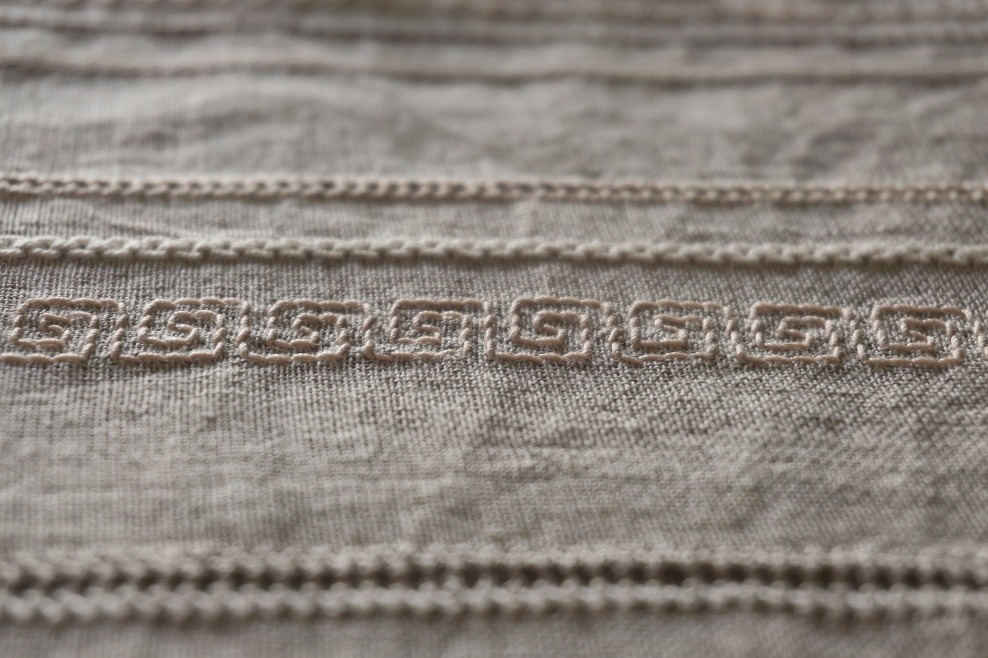 Detail of satin stitch on wool
